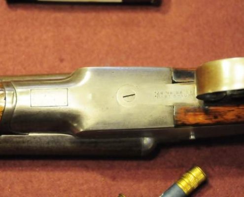 Lafever Shotgun Upside Down With a Shotgun Shell